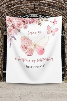 a white banner with pink flowers and butterflies on it that says, have to be a blessing or gutterless the johnsons