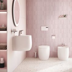 a bathroom with two toilets and a sink next to each other in front of a pink wall