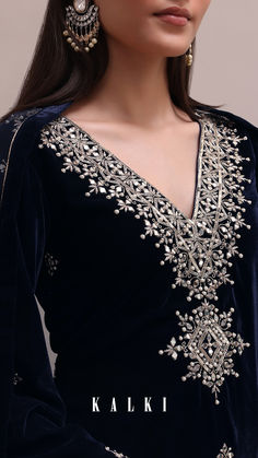 Enhance your wedding wear with our Blue Velvet Embroidered Dhoti Set. It features intricate mirror work, sequins, and cut dana detailing on a luxurious velvet fabric. The flared sleeves kurta is paired with a dhoti and an embroidered net dupatta. Package includes one kurta, dhoti, and dupatta. Intricate Mirror, Mirror Work Embroidery, Suits For Women Indian, Velvet Suit Design, Mirror Embroidery, Kaftan Designs, Velvet Dress Designs, Draping Fashion, Navy Blue Velvet