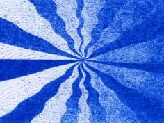 an abstract blue and white background that looks like a vortex in the middle of it