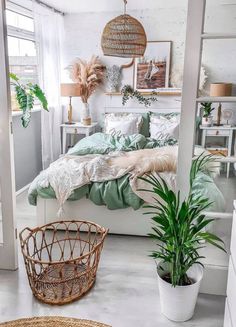 a bedroom with white walls and green bedding, wicker baskets on the floor