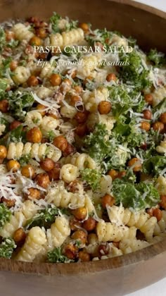 pasta with broccoli, chickpeas and parmesan cheese in a wooden bowl