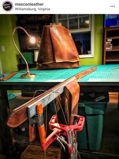 an assortment of tools are sitting on a table in a room with green walls and blue flooring