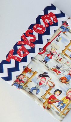 three baby bibs with cowboy designs and red, white, and blue chevrons