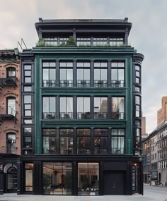 an apartment building with lots of windows and balconies