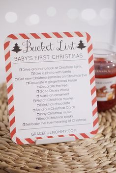 a baby's first christmas list on a wicker basket next to jams