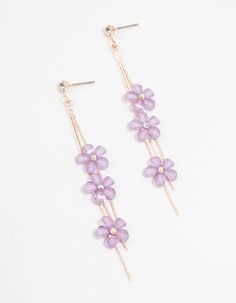 two pairs of earrings with flowers hanging from them