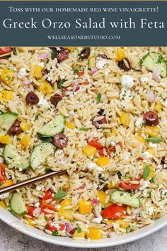 greek orzo salad with feta in a white bowl