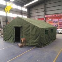 a large tent in a warehouse with chairs around it