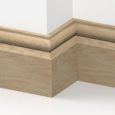 the corner of a wooden frame with white walls