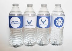 four bottled water bottles with labels on them