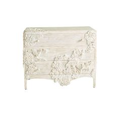 a white dresser with flowers on the front and drawers, in an ornate pattern is shown