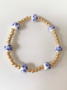 Blue Floral gold beaded bracelet Gold Beaded Bracelet, Preppy Jewelry, Jewelry Board, Beading Jewelery, Jewelry Boards, Gold Bead Bracelets, Pretty Jewelry, Jewelry Lookbook, Pretty Shoes