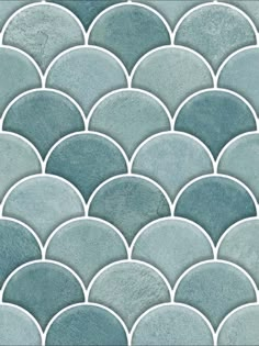 a blue and white mosaic tile with circles on the bottom, in shades of gray