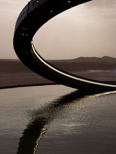 a large metal object floating on top of a body of water