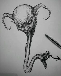 a pencil drawing of an alien head with its mouth open and tongue out, next to a sharpie pen