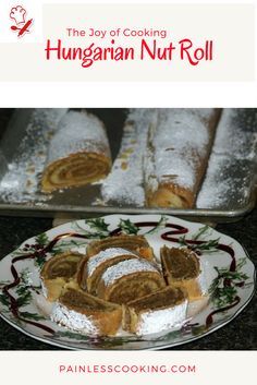 a plate with some food on it next to a pan filled with bread rolls and powdered sugar