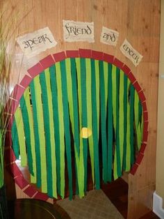 the very hungry caterpillar door is decorated with strips of green and red paper