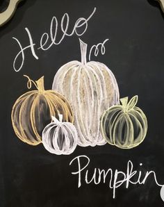 chalk drawing of pumpkins and the words hello to pumpkin written in white on a blackboard