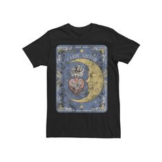 a black t - shirt with an image of the moon and two cats on it