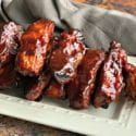 several pieces of meat sitting on a plate