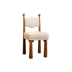 a white chair with wooden legs and a cushion on it's backrest, against a white background