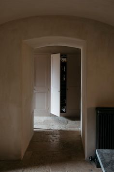 an archway leading to another room in a house