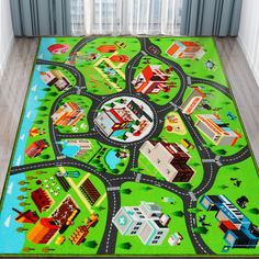 a child's play rug with cars and buildings on it