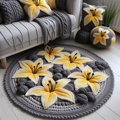 a living room with white and yellow flowers on the rug