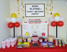 a birthday party with popcorn and balloons