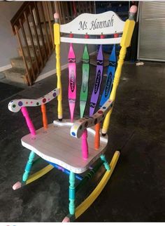 a child's rocking chair made out of crayons