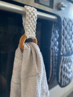 a towel hanging on the handle of an oven