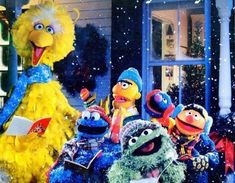 the sesame street gang is dressed up for christmas