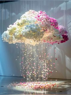 a cloud filled with flowers floating from the ceiling