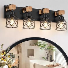 four light bathroom fixture with wooden accents and metal caged lights on the wall above it