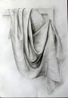 a pencil drawing of a folded cloth on paper with a wooden frame in the background