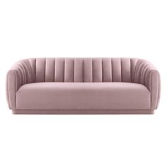 a pink velvet couch with pleated back and arms, viewed from the front angle