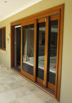 an empty room with sliding glass doors on the outside