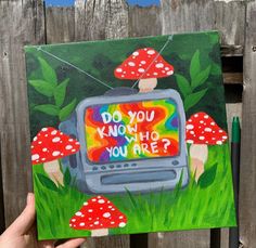 a painting of a tv with mushrooms on it and the words do you know who you are?