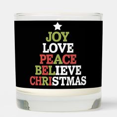 a candle that says joy love peace believe christmas