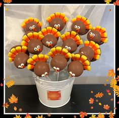 a bucket filled with chocolate covered turkeys on top of a table