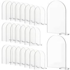 six clear acrylic display stands with curved bases and one round base, each holding an individual item