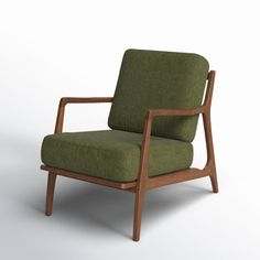 a green chair sitting on top of a white floor next to a wooden armrest