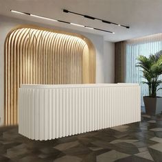 a large white radiator sitting in front of a window next to a potted plant