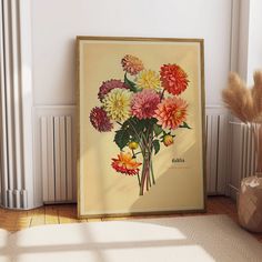 a vase with flowers in it sitting next to a radiator on the floor