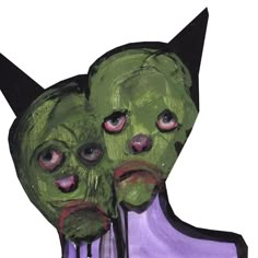 two creepy looking green faces with black horns