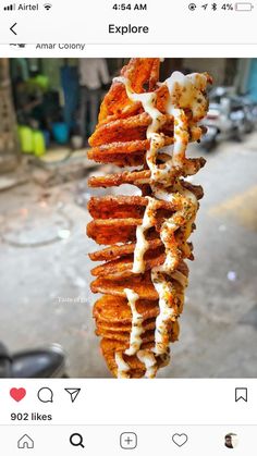 the food is being held up by someone's hand