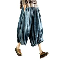 Rediscover the essence of y2k fashion with our pleated culottes denim pants from our 2023 Spring Collection! Crafted from luxe denim with a high-waisted silhouette. these vintage-inspired gaucho feature a unique folded design that adds a touch of sophisticated finesse. A zipper closure ensures comfort and effortless style. making these pants a must-have for the fashionista in you!Why This Piece Is a Wardrobe StapleStrike the perfect balance between retro and modern trend with these timeless culo Vintage Oversized Straight Leg Bottoms, Cotton Wide Leg Cropped Jeans For Fall, Wide-leg Cotton Cropped Jeans For Fall, Vintage Oversized Wide Leg Bottoms, Baggy Vintage Denim Blue Pants, Vintage Baggy Denim Blue Pants, Washed Wide Leg Bottoms For Fall, Casual Cotton Pleated Wide Leg Pants, Cotton Pleated Ankle-length Bottoms