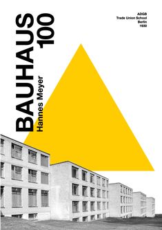 a yellow triangle on top of a white building with the words bauhauq written below it