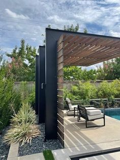 an outdoor patio with chairs and a pergolated area next to the swimming pool